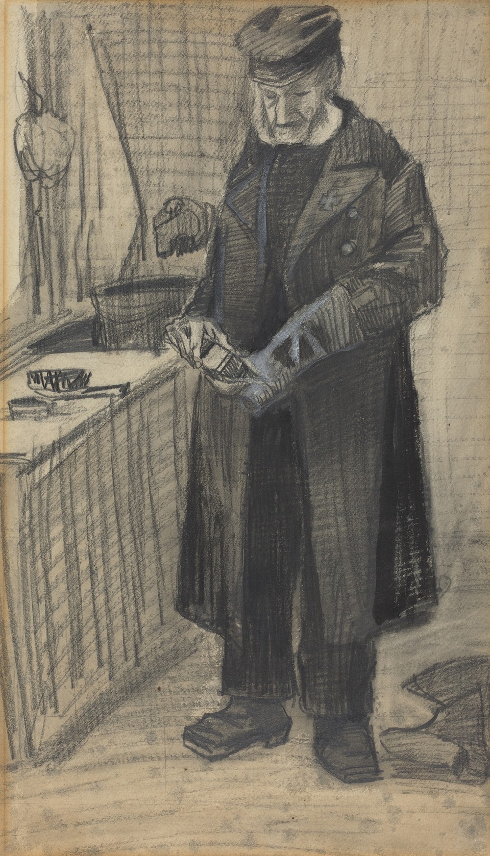 Man Polishing A Boot