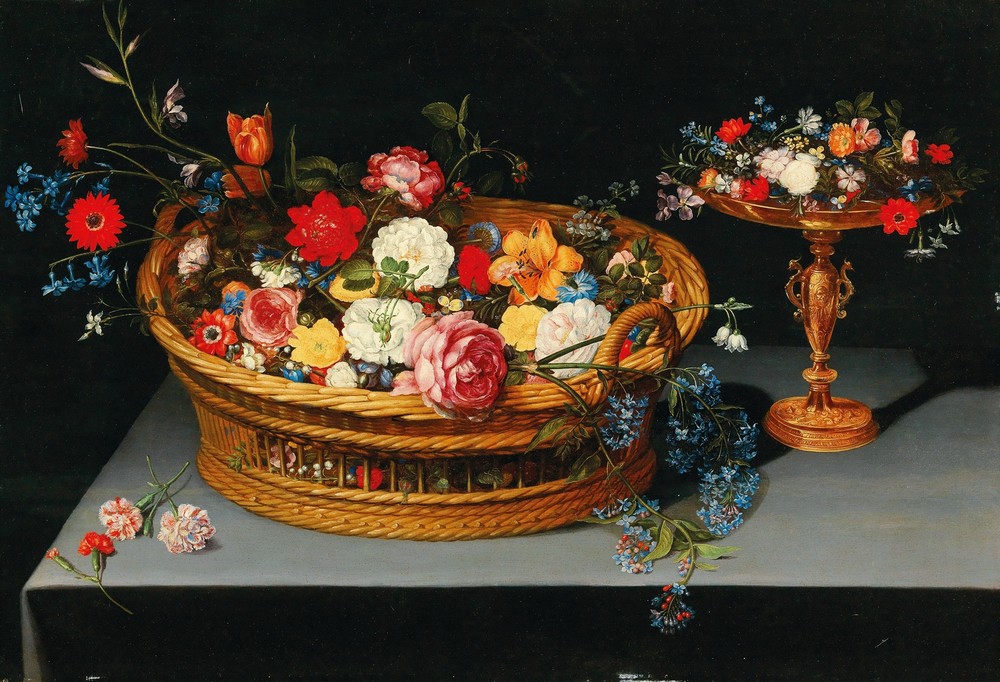 Mixed flowers in a basket with a tazza nearby